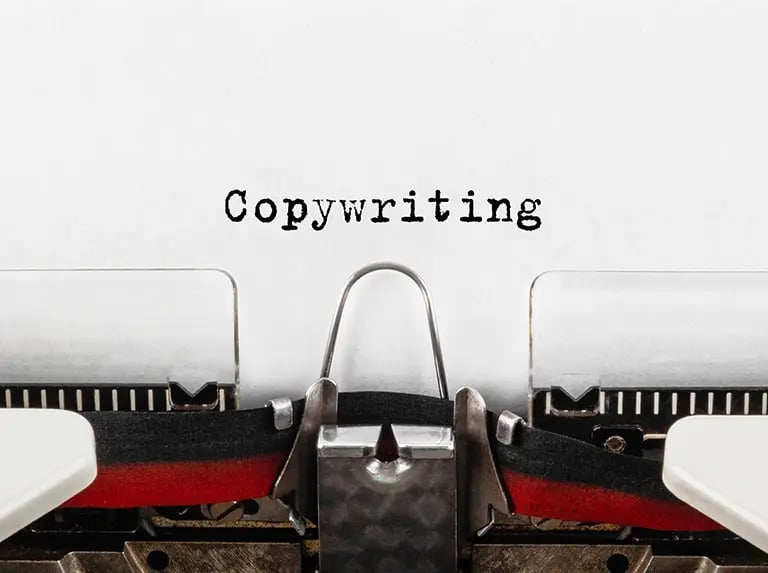 copywriting written on a page with a typewriter below