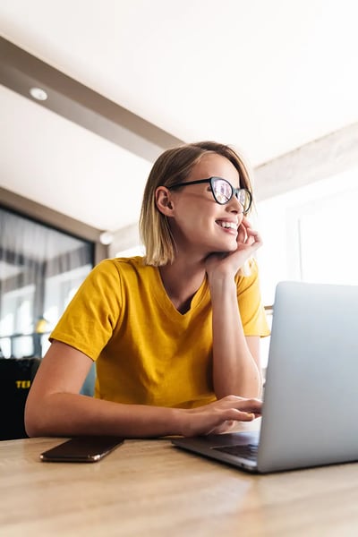 woman looking ad google ads services for her local business on a laptop